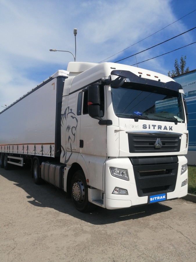 Автомобиль-тягач SITRAK C7H 4х2 + Полуприцеп шторный UAT SCFG 9226.01